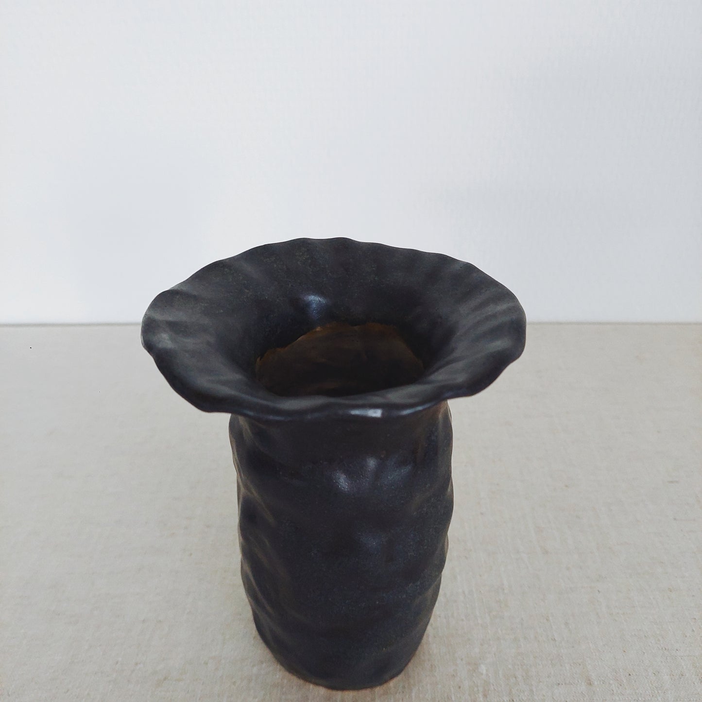 Small textured black vase